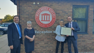 Alberto Costa MP with Headteacher Stephen Snelson and members of staff. 